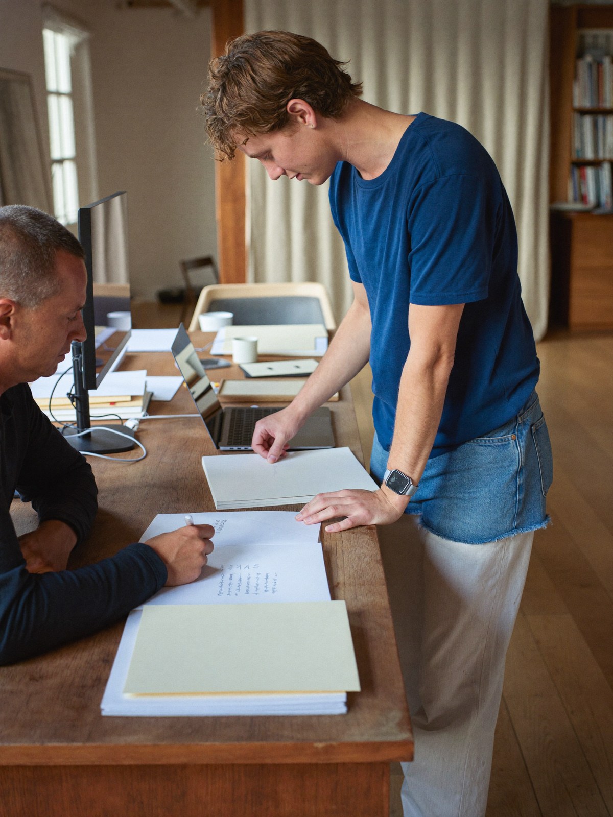 Business partners planning a company at a shared desk
